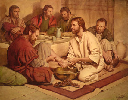 Jésus lavant les pieds humblement.